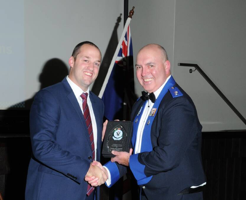Detective Senior Constable Justin Williams is congratulated by Chifley Police District's Supt Paul McDonald.