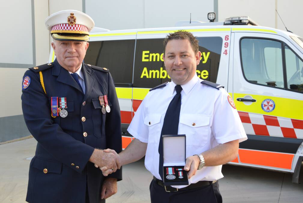 Inspector Peter Rowlands (left, pictured with Daniel Wright) has received an Ambulance Service Medal. Photo: Barbara Watt