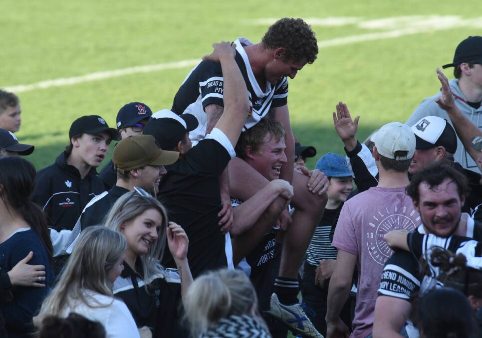 SAVOURING IT: Jake Grace sits on the shoulders of teammate Jake Haddrill during Sunday's title celebrations. Photo: AMY McINTYRE