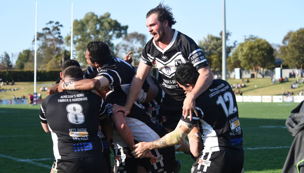 ON THE WAY: Forbes players celebrate one of the Magpies tries during Sunday's Group 11 grand final. Photo: AMY McINTYRE