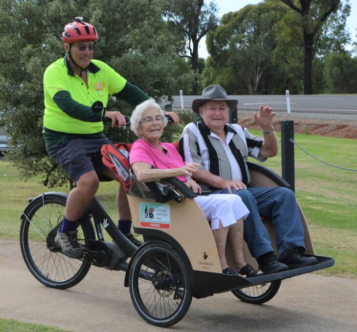 ALL SMILES: Peter Guppy from Cycling Without Age Parkes takes Pat and Ray Wilson for a trishaw ride last weekend. You can take a ride from Lions Park on Wedneday and Saturday mornings. Photo: KRISTY WILLIAMS.