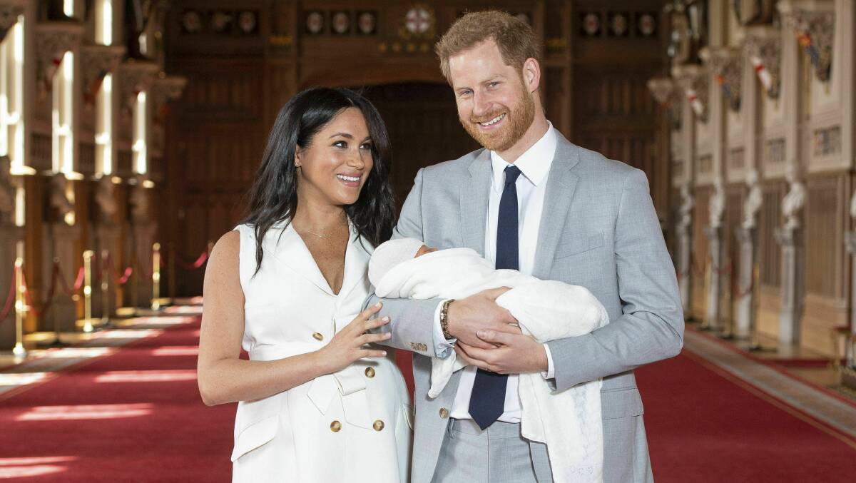 Britain's Prince Harry and Meghan, Duchess of Sussex, during a photocall with their newborn son, in St George's Hall at Windsor Castle. Picture: AP