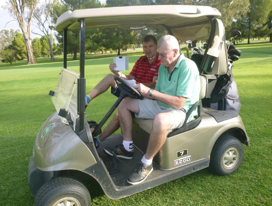 Easter Casual Style: Marty Cahill and Phil Maher count their score after a good day at golf, completed in casual style in a cart.