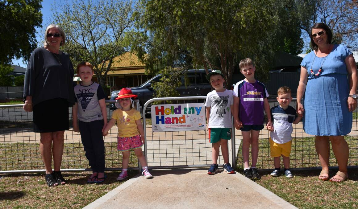 Phyllis Miller, Lane Smith, Pearl Paradowski, Cameron, Juno, Sam and Louise Webb. Forbes Shire Council has partnered with The Little Blue Dinosaur Foundation for its 'Hold My Hand' campaign.