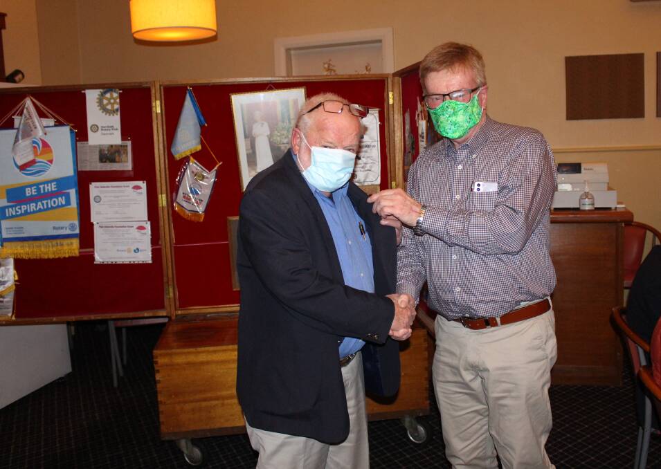 Garry Pymont (right) hands over to new president Chris Finkel at the Rotary Changeover dinner.