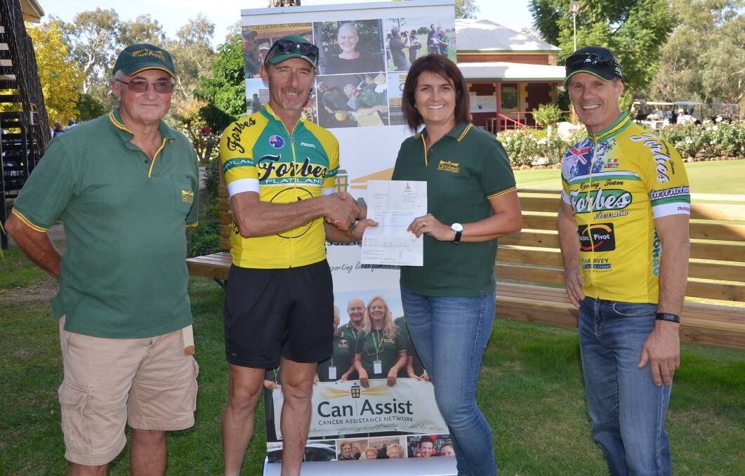 Marco Carelli and Garry Percy from the Forbes Flat Land Cyclo Sportif presenting the funds to John Schrader and Lisa Grayson from Can Assist.