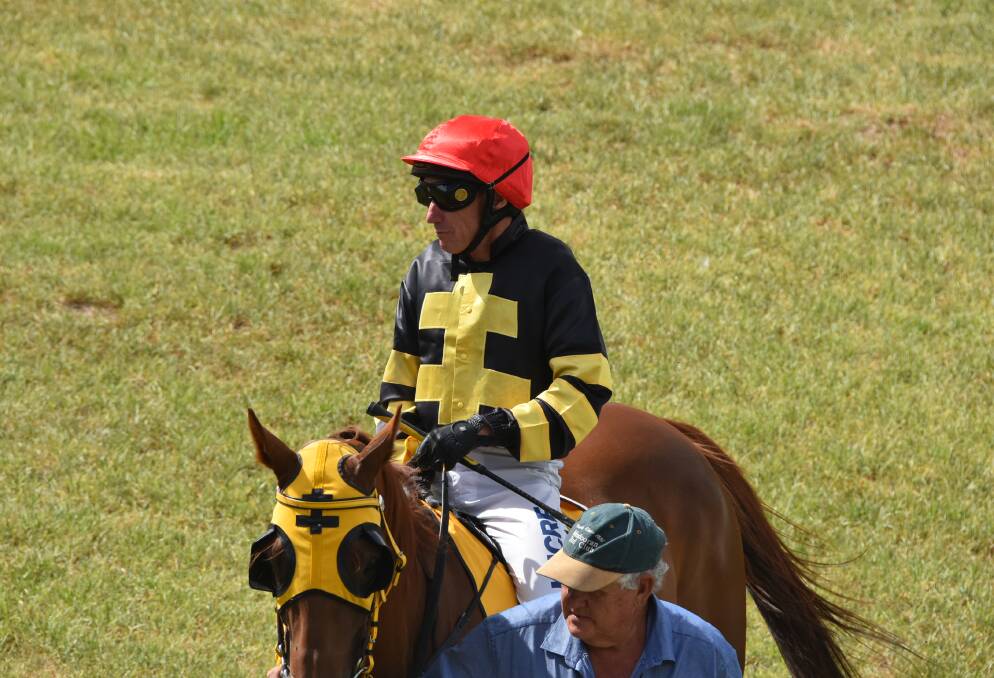Trainer Dennis Bush leads Hu Hit Hu around before the Forbes galloper's win at Cowra earlier this year.