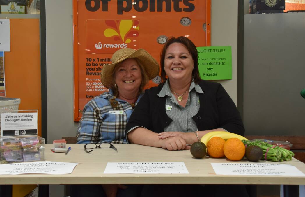 Kathryn Merritt and Kim Acret were operating the raffle ticket and donation desk down at Woolworths.