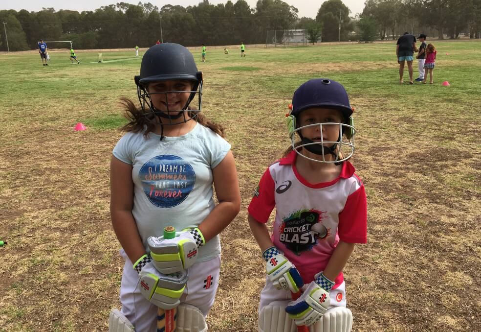 Zoe Frazer and Holly Maslin going out to chase a hundred in the U-10s last weekend.