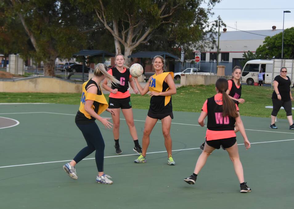 Nicole Mee from minor premiers Gundamain passing to a team mate in this season's Spring night netball competition.