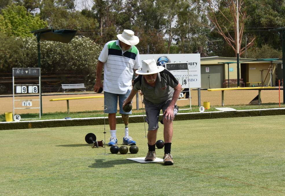 Al Phillips lining up his bowl on the Forbes bowling club greens. 
