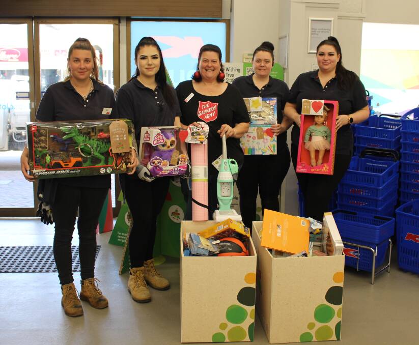 K-hub team members Bec, Belle, Katie and Jess were helping Salvation Army's Major Sandra Walmsley (centre) pack up the donations in preparation of sending them out as part of Christmas hampers.