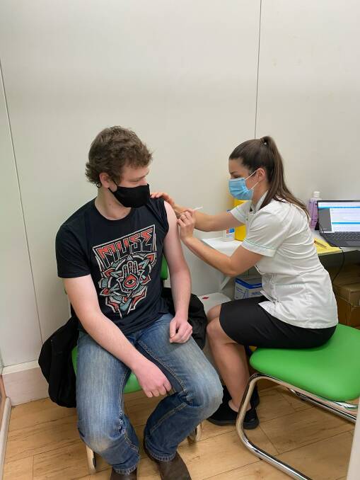 Pharmacist Shannon Hurley vaccinating patient Brodie MacDonald at Life Pharmacy. Photo supplied.
