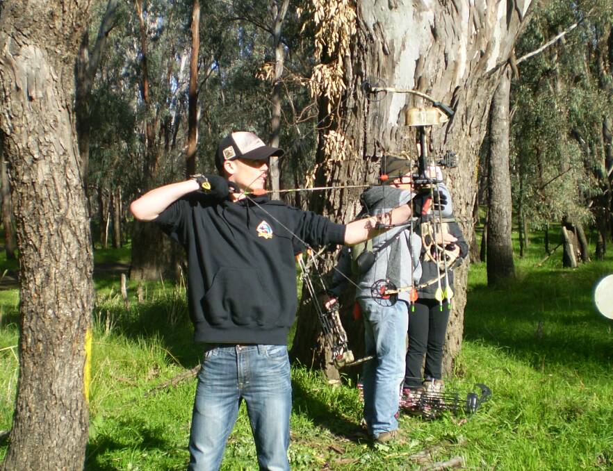 File photo of Archery Club members at a shoot.