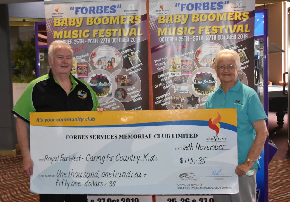 Baby Boomers Music Festival organiser Stephen Cheney presented Molly Neilsen from the Royal Far West Op Shop with the money raised from the charity show.