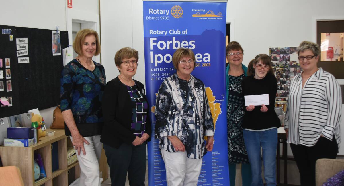 Rotary Ipomoea members Helen Pitt, Therese Newell and Sue-Ann Nixon present with Sarah Duncan and Leanne Allegri from Aruma.