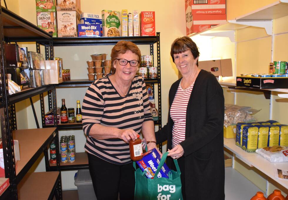 Sue Jolliffe and Caroline Wells were getting the pantry ready for the official opening.