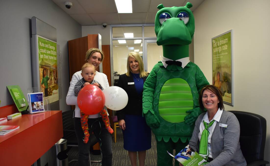 Tina and George Cooper with Chris Fisicaro, "Happy" the dragon and Melissa Nicholson.