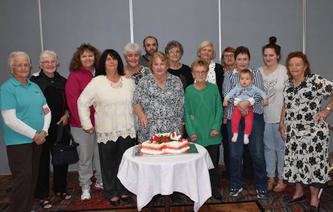 Volunteers and members of the Sunshine Club celebrate the organisation's 80th birthday.