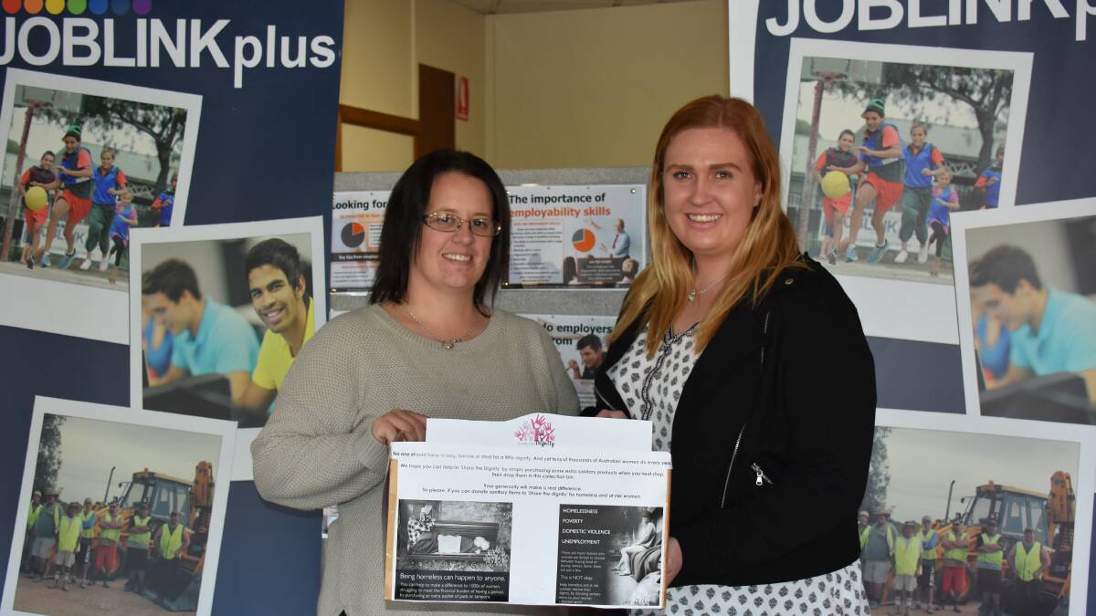 COLLECTION POINT: Rachael Hylend and Elise Cheney are on hand to accept sanitary product donations for the Share the Dignity drive at Joblink Plus.
