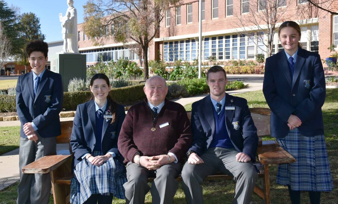 Brother Michael (pictured centre) will be retiring from his position at Red Bend Catholic College. Also pictured; Clayton Wing Yip, Evie Martin, Benji Glasheen and Amity Payne.