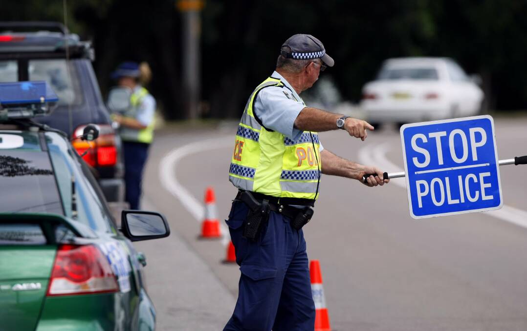 Visible presence: Police will be on the roads and performing random breath tests and speed checks over the Easter long weekend in a bid to stop the road toll rising. Photo: FILE