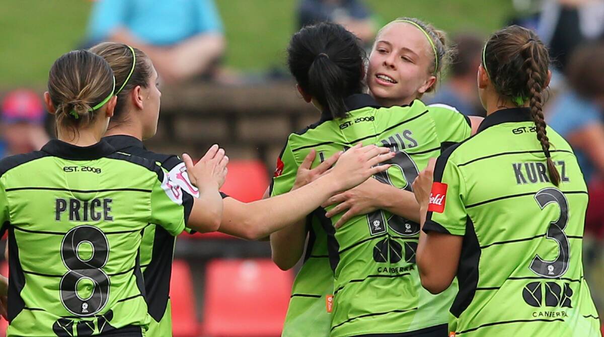 Canberra United celebrate a first W-League goal for Ashlie Croft, centre, in yesterday's win over the Jets in Newcastle. Picture: Getty Images