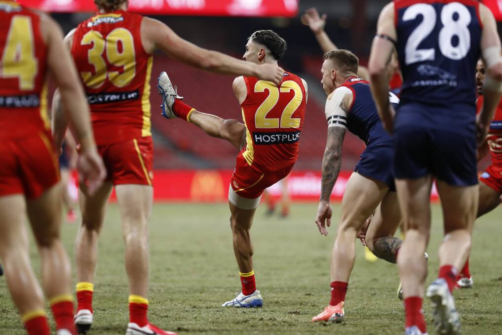 The Gold Coast Suns' Izak Rankine kicks his first AFL goal during the Round 6 match against the Melbourne Demons at Giants Stadium on Saturday. Photo: Ryan Pierse/Getty Images