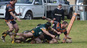 CLUTCH: Canowindra fullback Jayden Brown scores a try to tie the match with Trundle. Photo: LACHLAN HARPER 