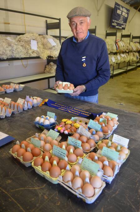 All your eggs in one basket: Norm Haley gathers some of the competitors eggs to get them ready for judging at the 2017 Forbes Show. 