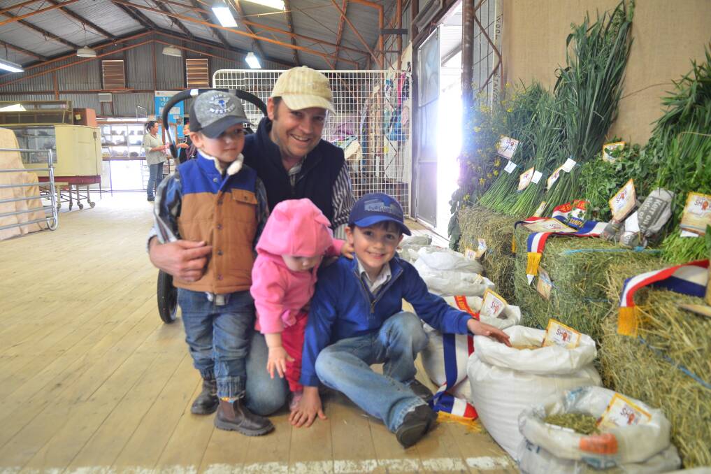 Checking out the good: John Whitty with Hamish, Matilda and Nate at the 2017 Eugowra Show. Photo: File.