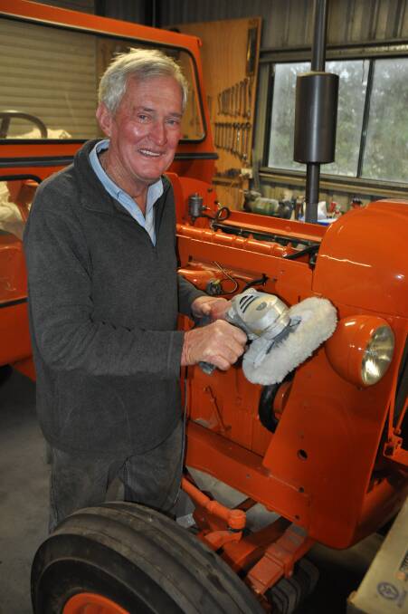 VINTAGE GOOD BLOKE: Buckrabendinni's Jim Cameron is our newest OAM. Pictured here with his magnificent 1952 Chamberlain tractor, an ongoing project