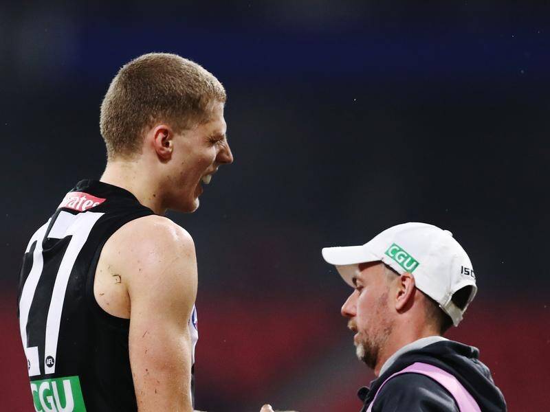 Collingwood debutant Will Kelly has a fractured arm suffered during the Pies' AFL win over Hawthorn.