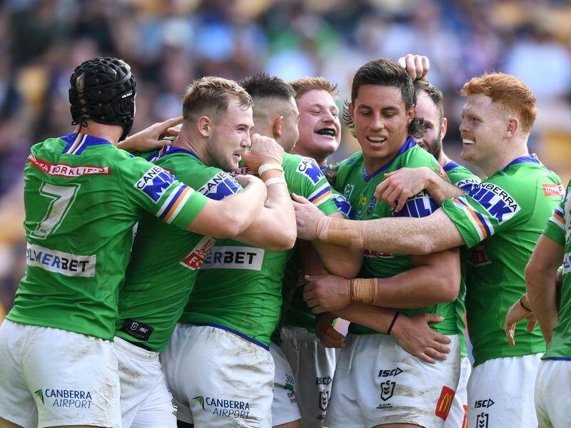 Raiders players celebrate the try of Corey Harawira-Naera during their defeat of Cronulla.