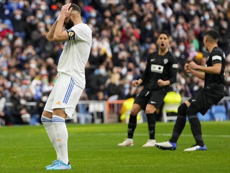 Real Madrid's Karim Benzema reacts after his miss from the penalty spot against Elche.