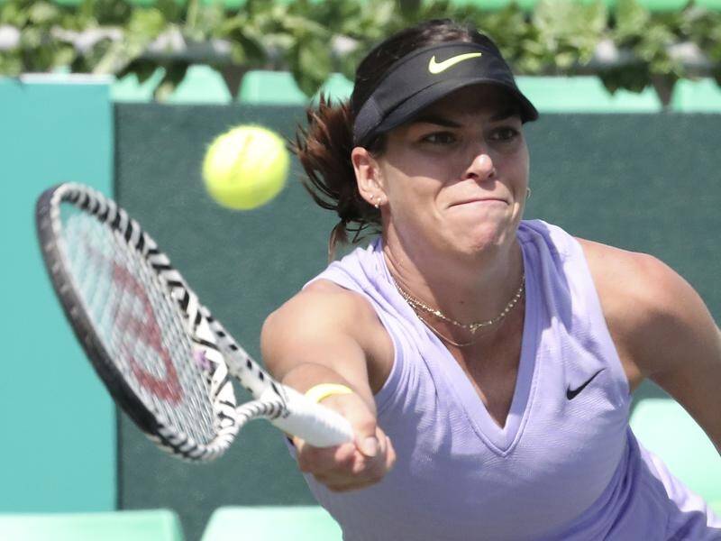 Ajla Tomljanovic is through to the second round of the China Open after Qiang Wang retired hurt.