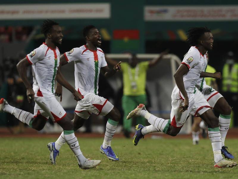 Burkina Faso players celebrate their Africa Cup of Nations penalty shootout win over Gabon.