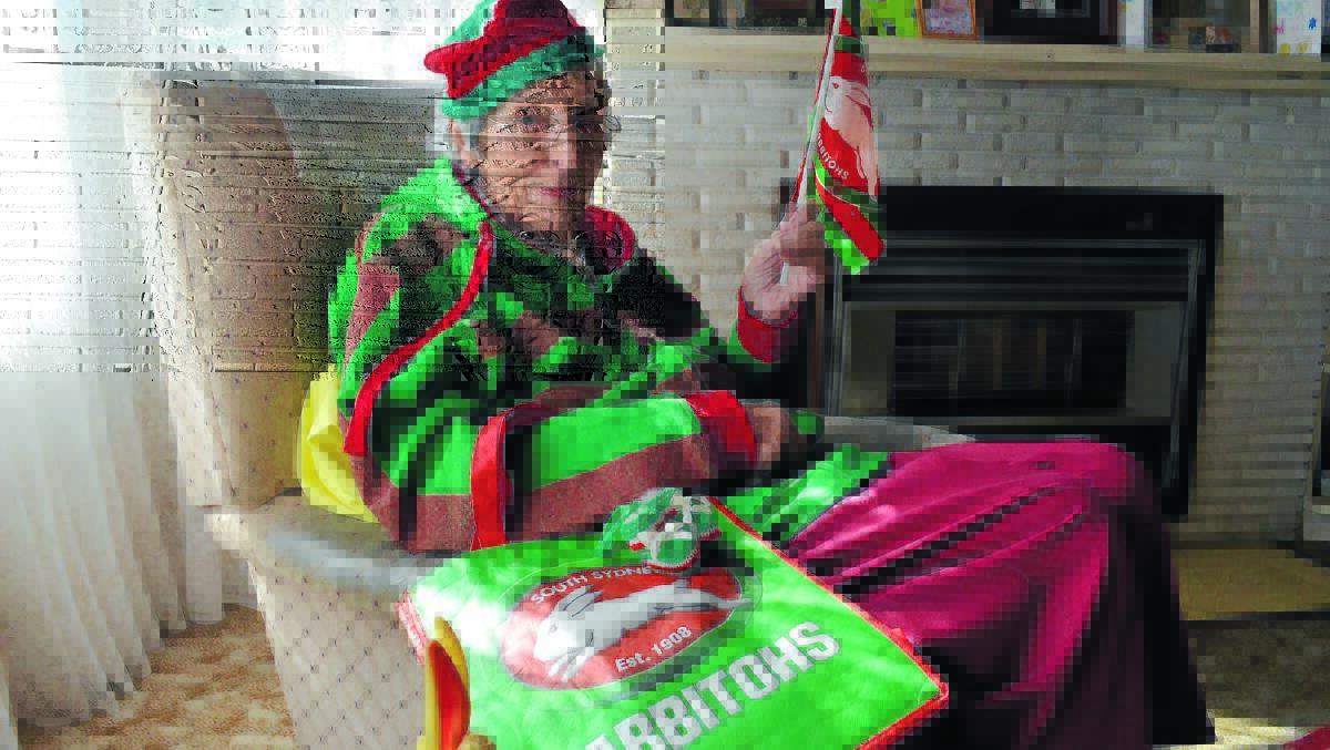 Wearing red and green and her mother’s Rabbitohs lifetime membership badge, 94-year-old Jean Dingwall has no doubt who will win this Sunday’s grand final.