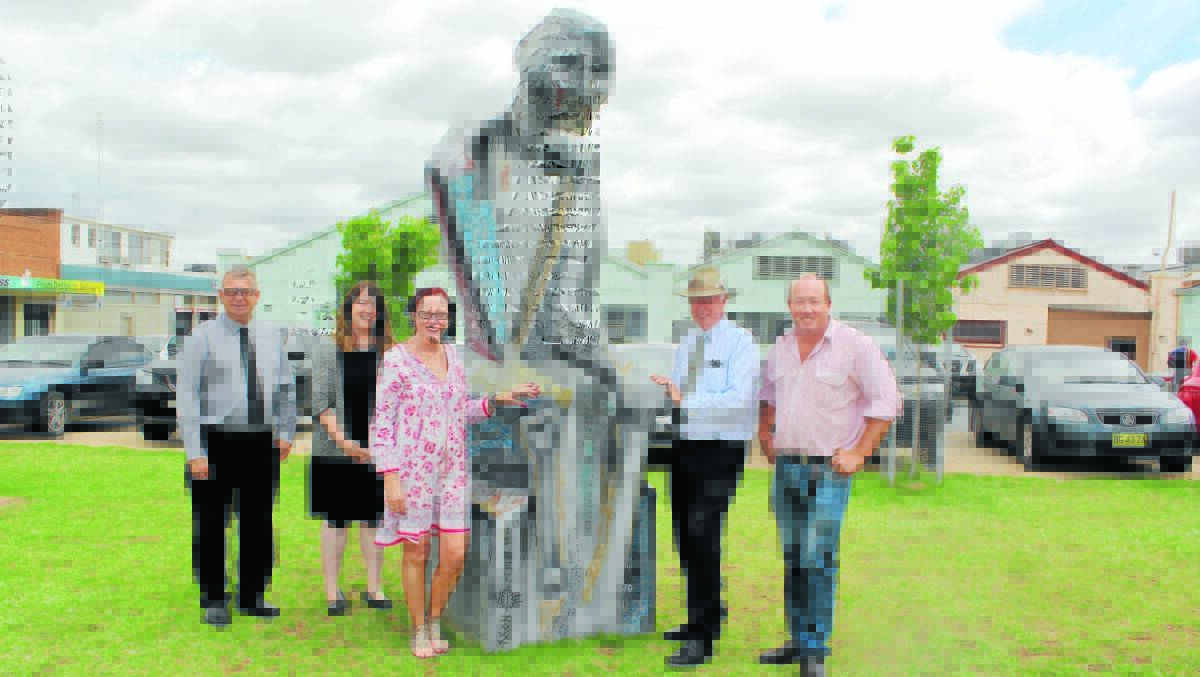 Mayor Phyllis Miller with Forbes Shire Council staff (l-r) Brian ­Steffen, Amy Millerd, Richard Morgan and Andrew Rawsthorne, admiring the recent purchase ­‘Inside Out’, created by local artist Roger Bennie. 1015thinkingman (2)