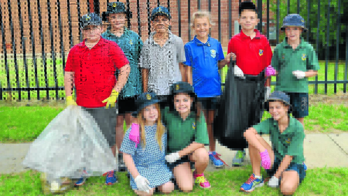 (back) Josh Tooze, Emily Thom, Dylan Reynolds, Jillisa Dabis, Ben Adams, Ben Quigley, (front) Hayley Nixon-Turner, Abi Dial and Dylan Prosser collected rubbish around Lake Forbes on Friday. 0214cleanup(11)