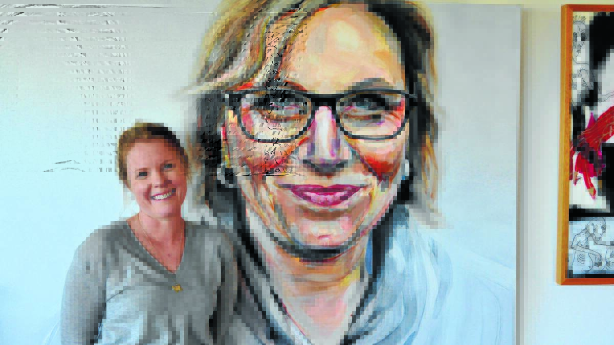 Parkes artist Jacqui Clark with her portrait of Australian of the Year Rosie Batty, which will go on exhibition for the Portia Geach prize at Sydney’s SH Ervin Gallery. 0915jacqui 009