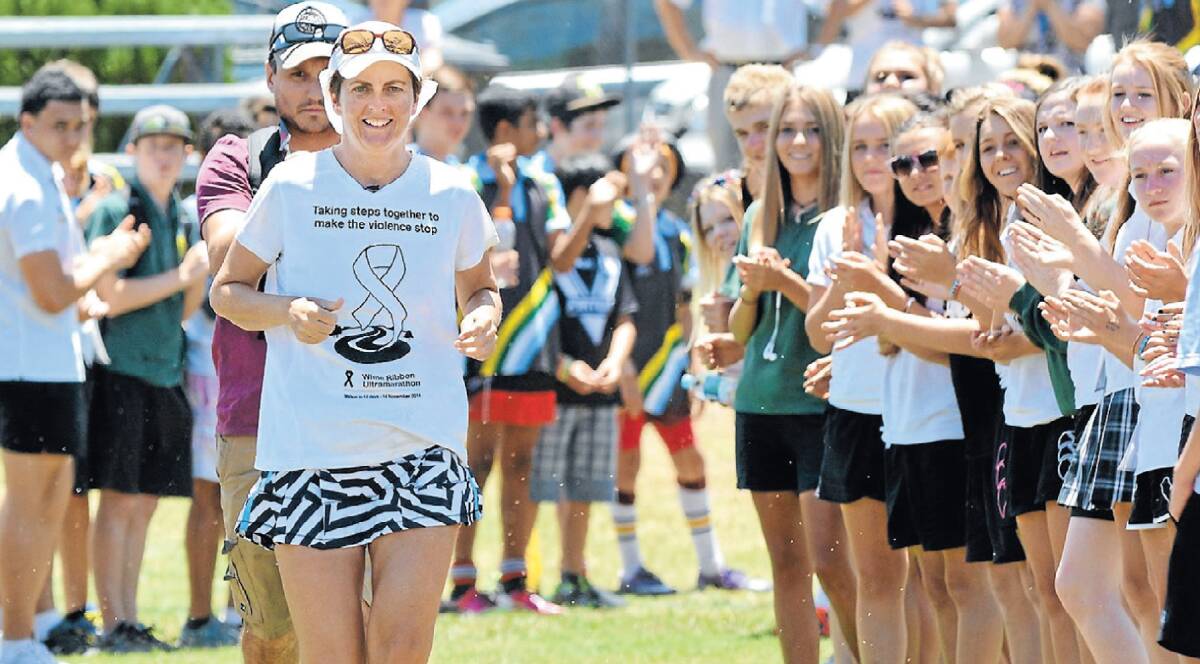 Ultramarathon runner Kirrily Dear was greeted with a guard of honour by local students as she arrived in Tamworth earlier this week. Kirrily is running 860km over a total of 12 days, ending in Forbes on Tuesday, to raise awareness about the epidemic of violence against women, particularly in regional communities. Photo courtesy of the Northern Daily Leader.