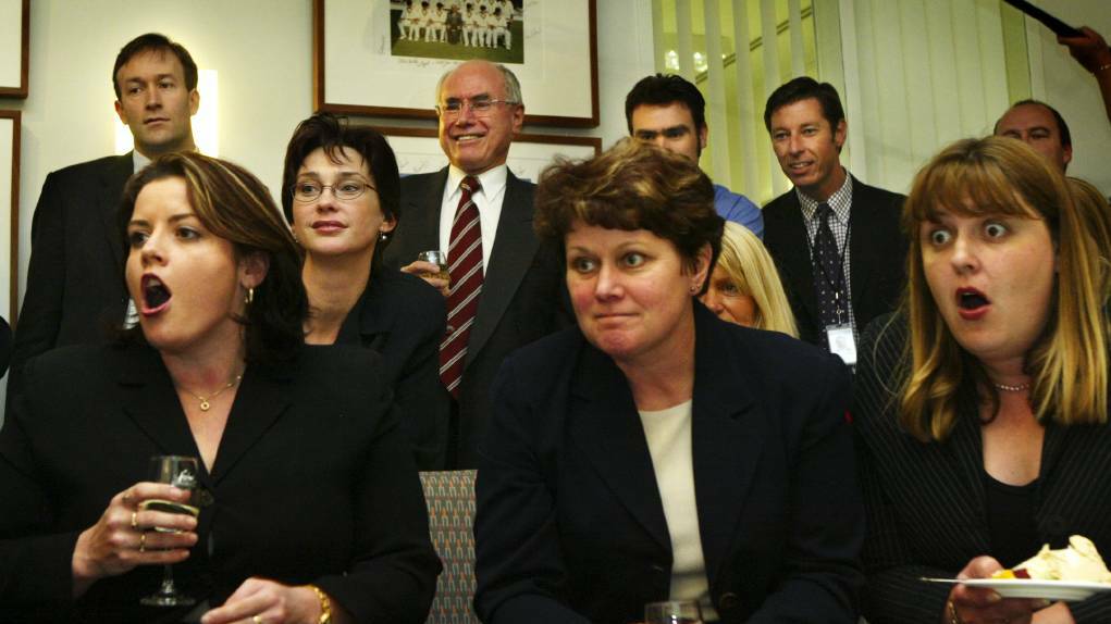 Then Prime Minister John Howard and some of his Canberra staff watch the Melbourne Cup race on television in 2003. Picture: Andrew Taylor