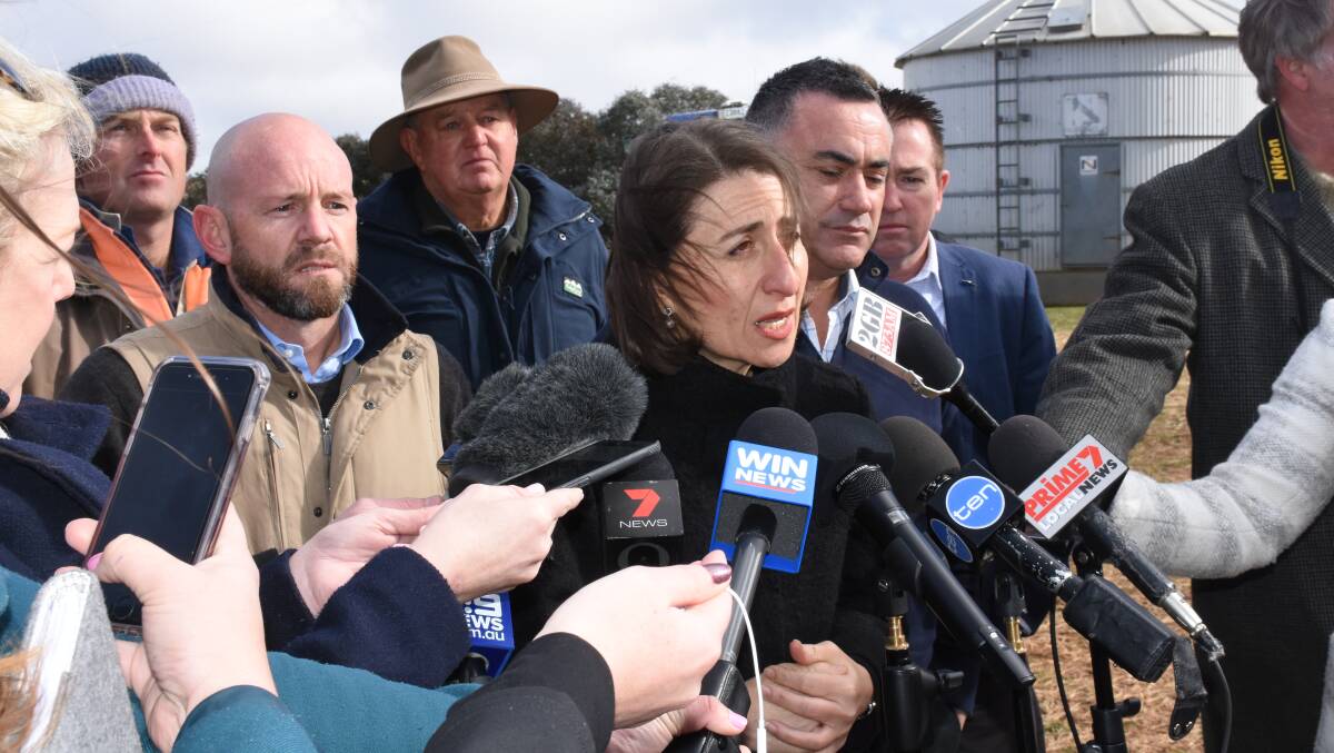 SUPPORT: NSW Premier Gladys Berejiklian visited a sheep and cattle property at Newbridge, near Bathurst, to make the $500 million announcement. Photo: NADINE MORTON 073018nmdrought1