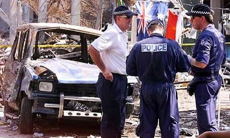 Mick Travers (far left) was the disaster victim identification coordinator for the Australian Federal Police in the aftermath of the attacks on October 12, 2002. Picture by AFP