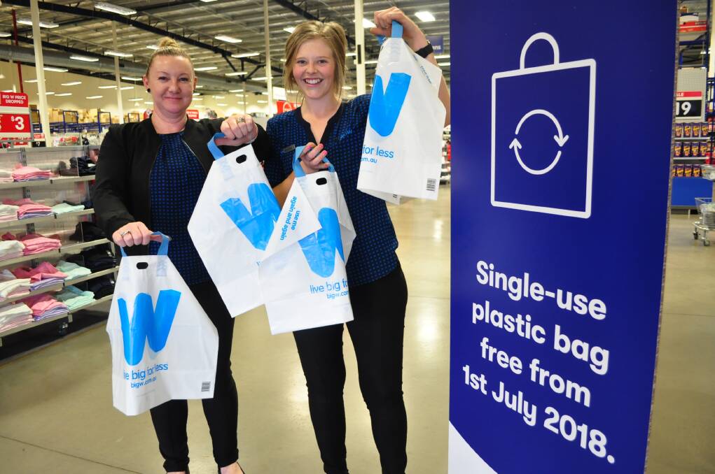 ALTERNATIVES: Parkes Big W store manager Joy Spice and employee Ashleigh Sense with the new thicker reusable plastic bags for 15 cents. Photo: Christine Little