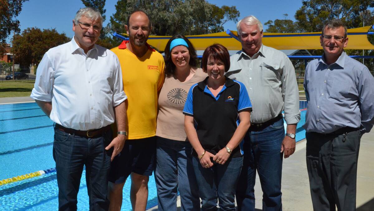 Forbes Shire Mayor Ron Penny, pool managers Brady and Ro Burns, Manager of Communications and Development Kristy Hartwig, Deputy Mayor Graeme Miller and General Manager Brian Steffen are all looking forward to the pool’s new solar heating panels. 1013poolsolar(1)