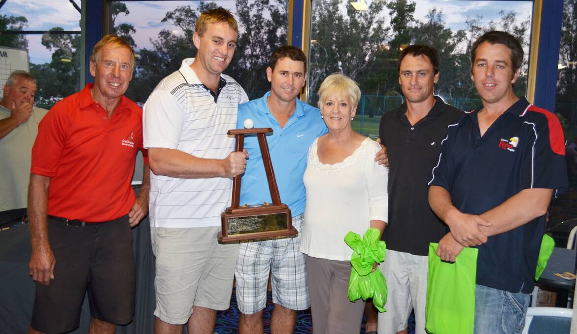 Ray (left) and Monica Sanderson with the trophy winning team (l-r) Adrian Acheson, Randal Grayson, Troy Howe and Tony ­Wallace. The foursome won the handicap event with 53 and 1/4 nett.